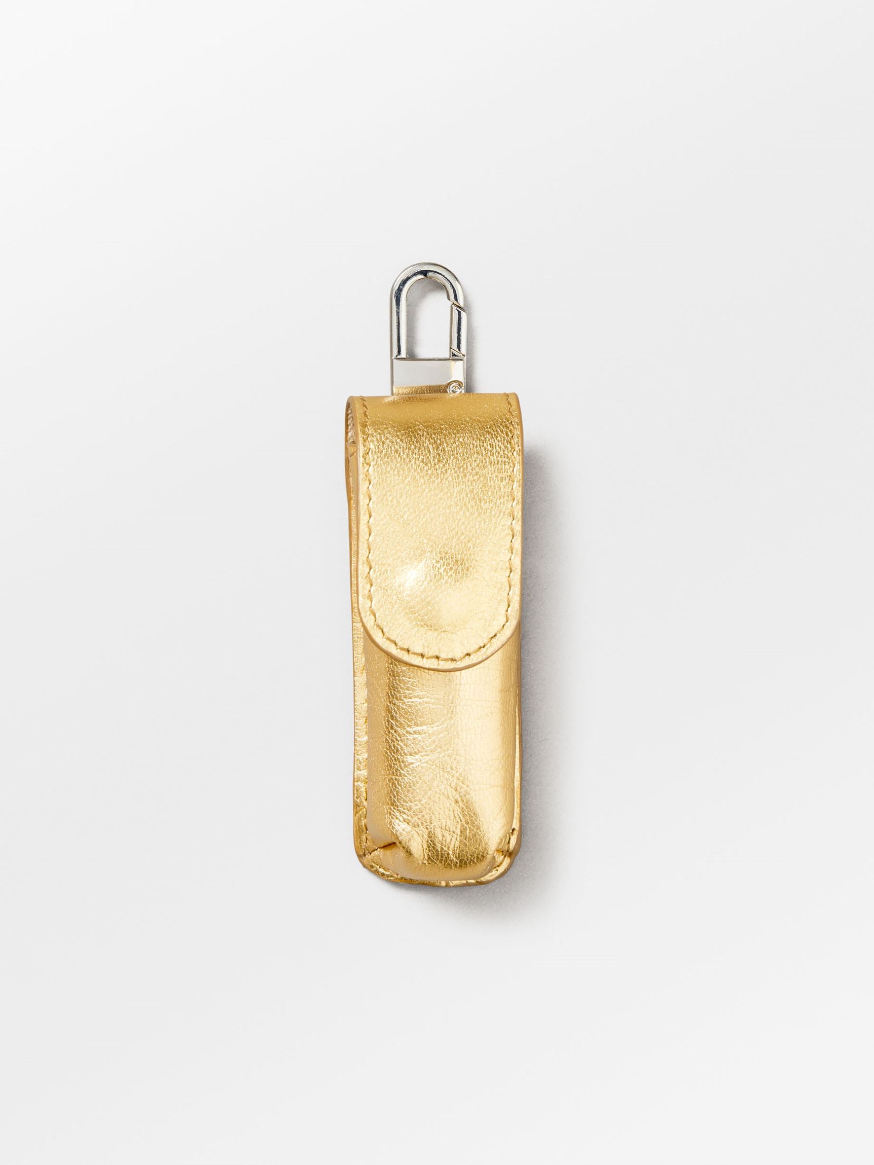 becks-ndergaard-glaze-lipstick-taschenanh-nger-gold-leder image 1