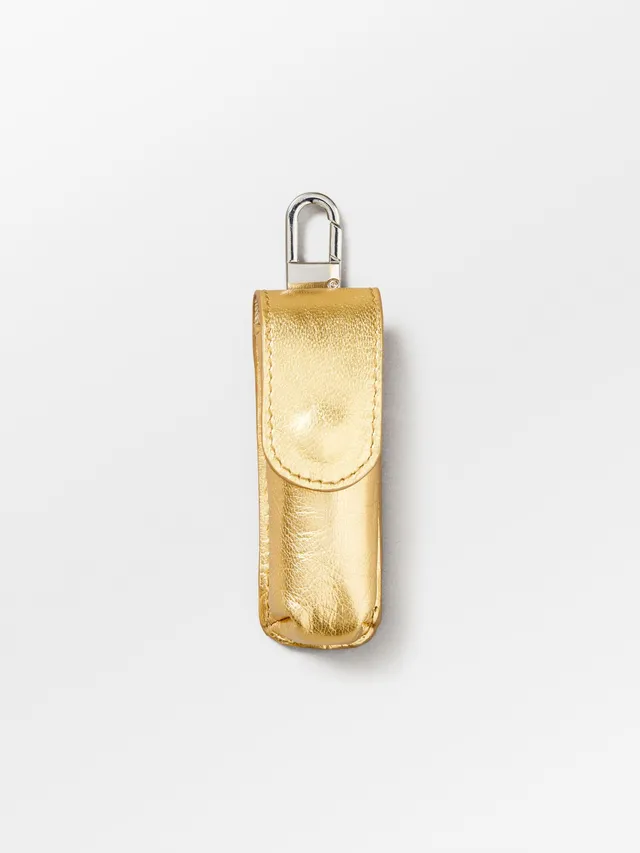 becks-ndergaard-glaze-lipstick-taschenanh-nger-gold-leder image 1
