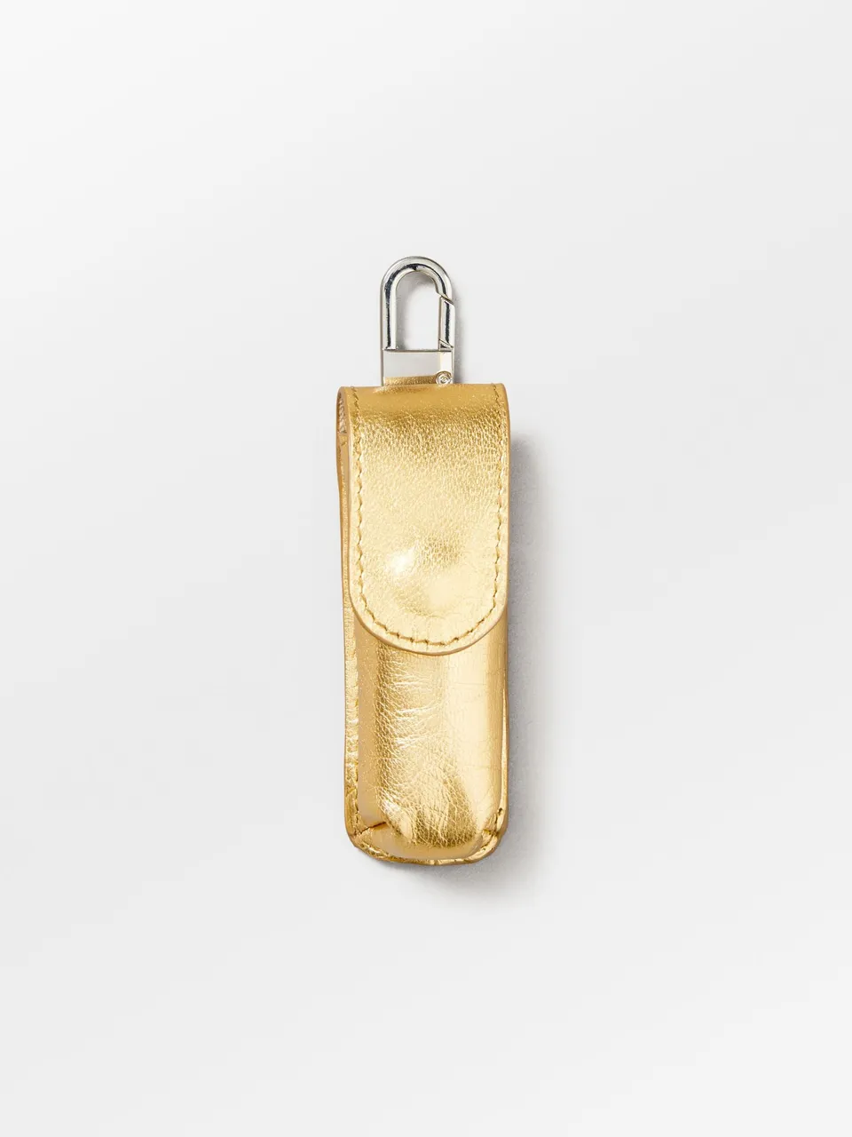 becks-ndergaard-glaze-lipstick-taschenanh-nger-gold-leder image 1